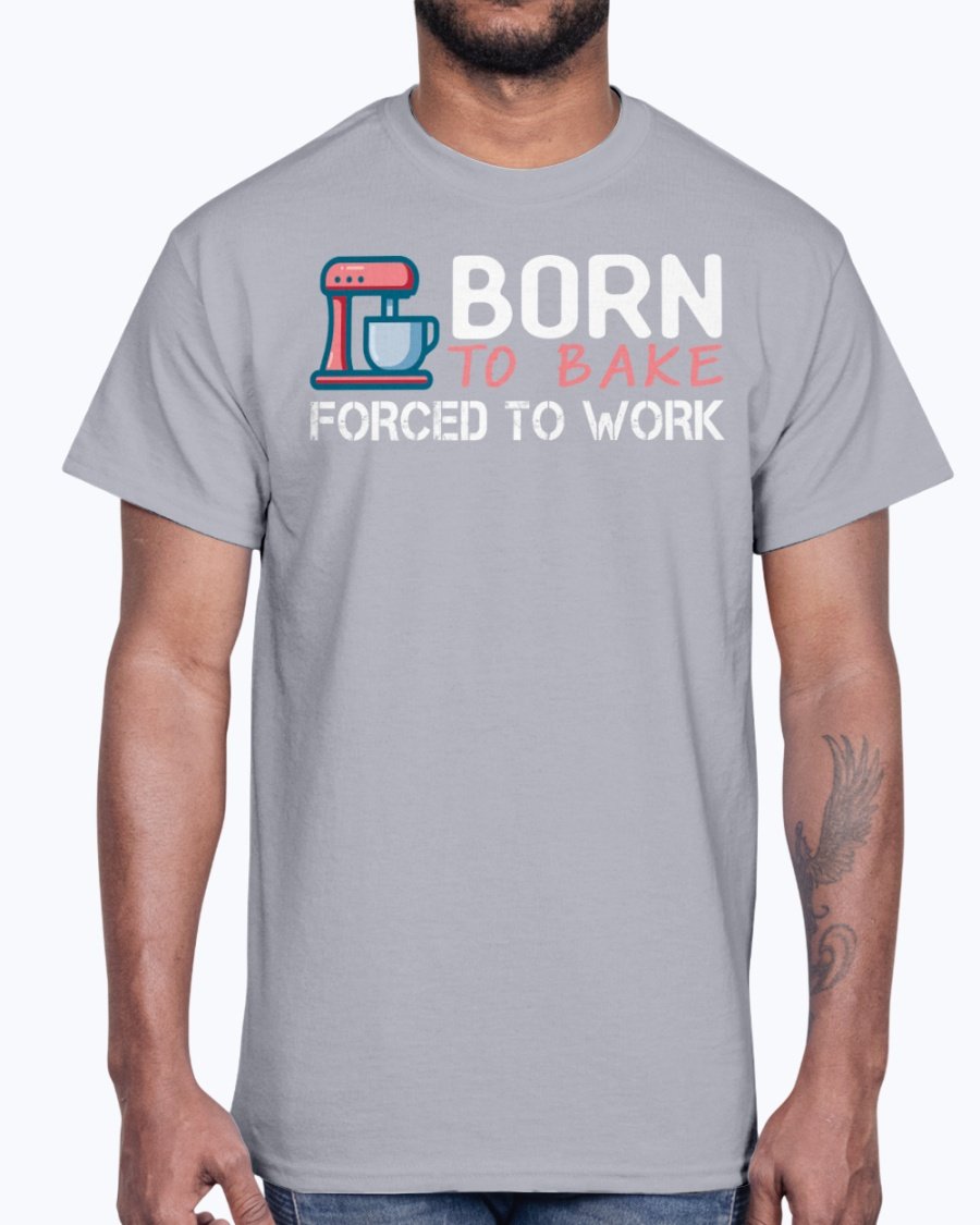 A stylish unisex cotton tee featuring the phrase 'Born To Bake Forced To Work', perfect for baking enthusiasts.