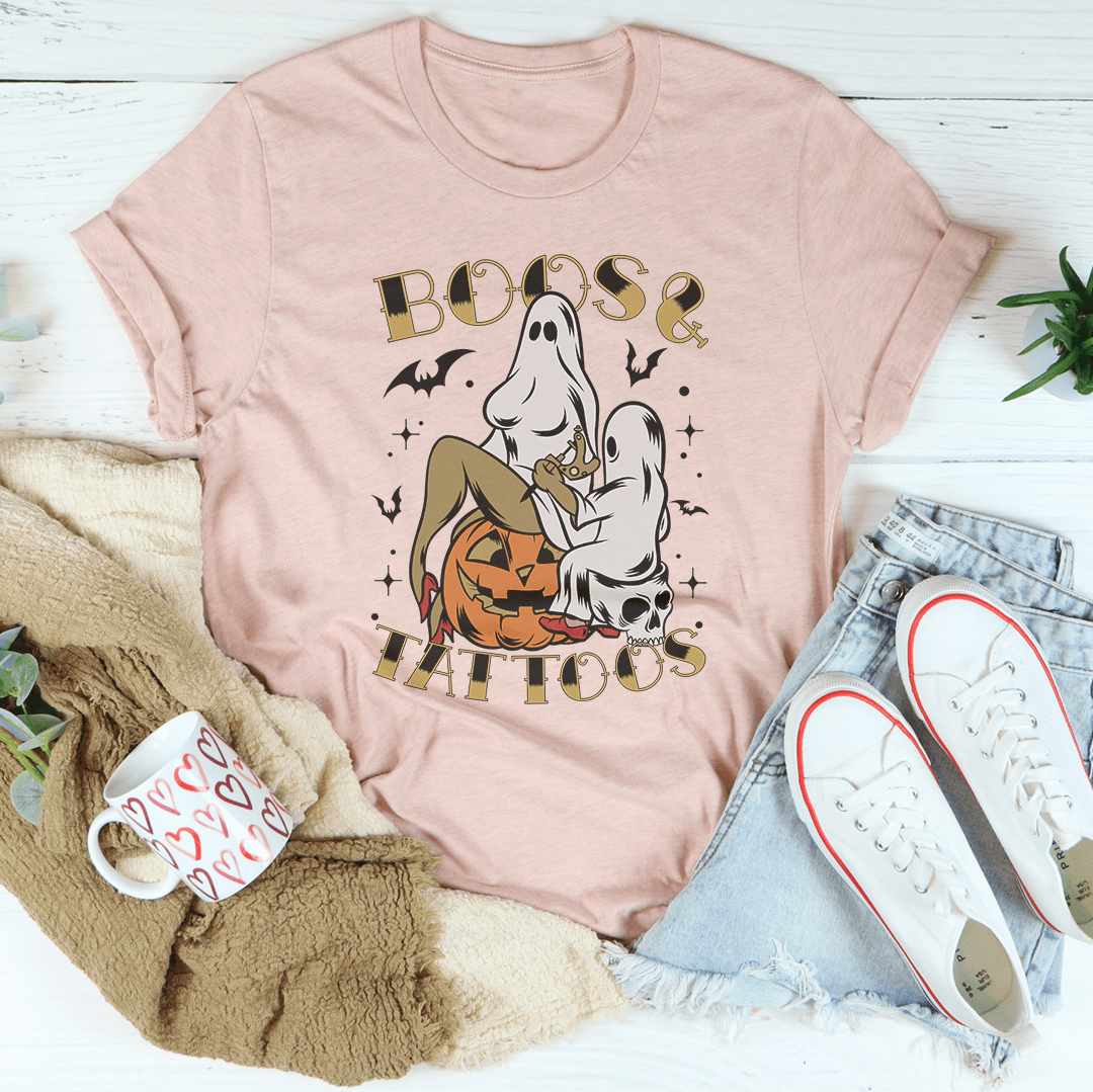 A stylish Boos & Tattoos Tee featuring vibrant Halloween-themed graphics, made from 100% soft cotton.