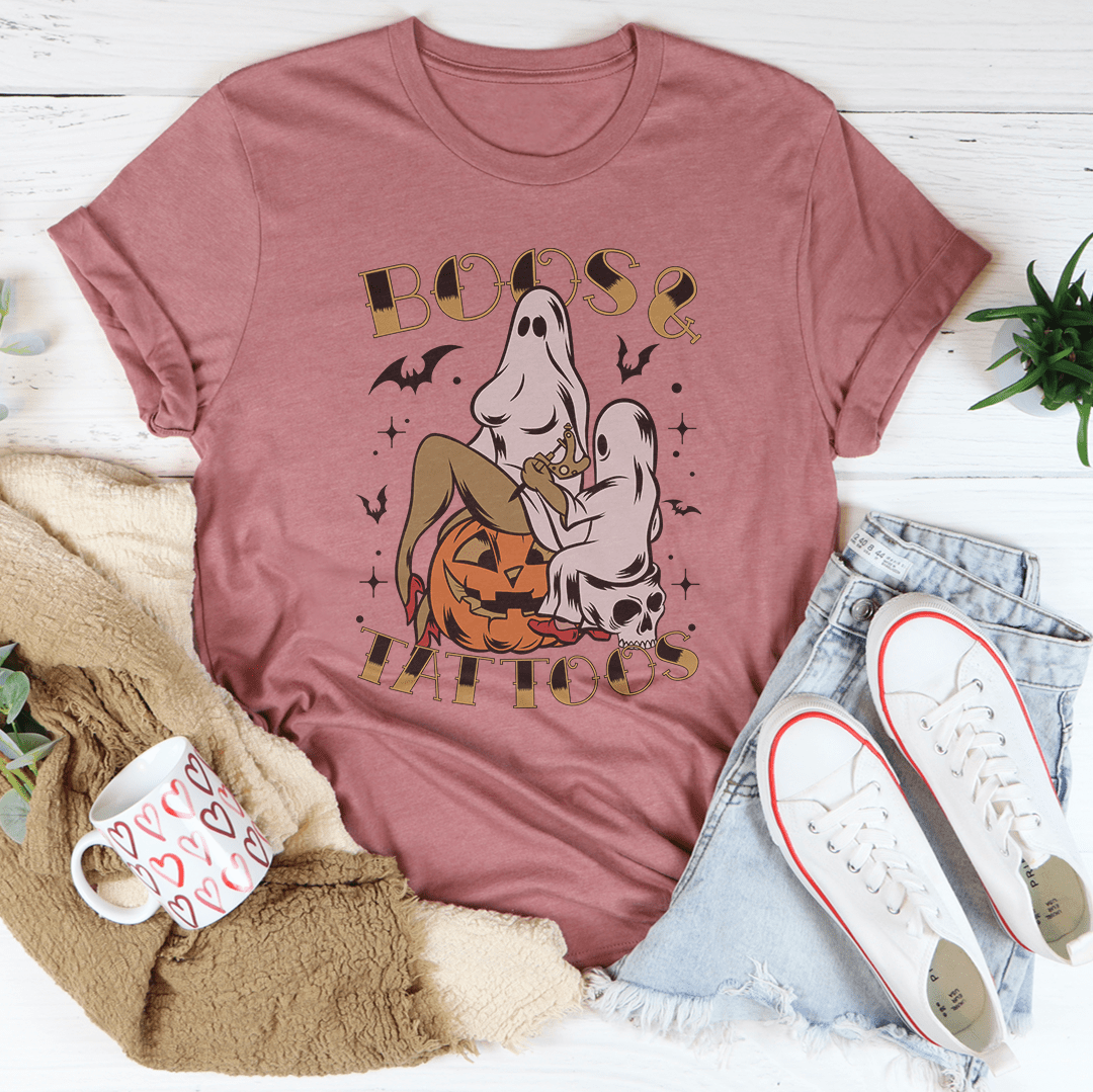 A stylish Boos & Tattoos Tee featuring vibrant Halloween-themed graphics, made from 100% soft cotton.