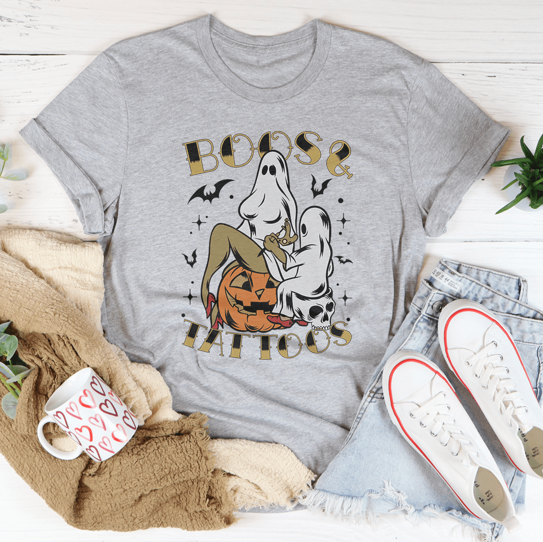 A stylish Boos & Tattoos Tee featuring vibrant Halloween-themed graphics, made from 100% soft cotton.