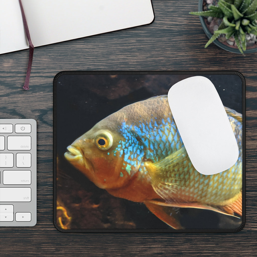 Brown and orange fish design gaming mouse pad with stitched edges, measuring 9x7 inches.