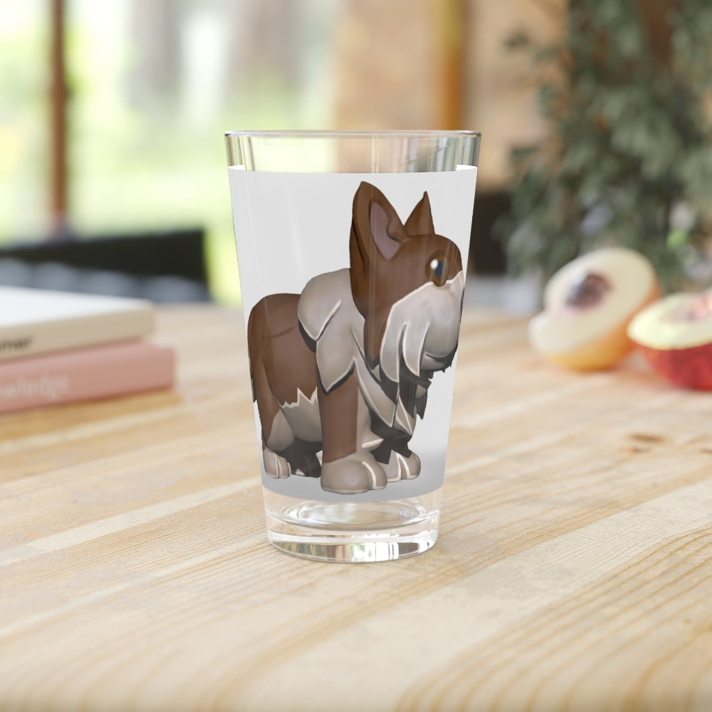A clear 16oz Brown Dog Pint Glass showcasing a custom printed design, perfect for beverages.
