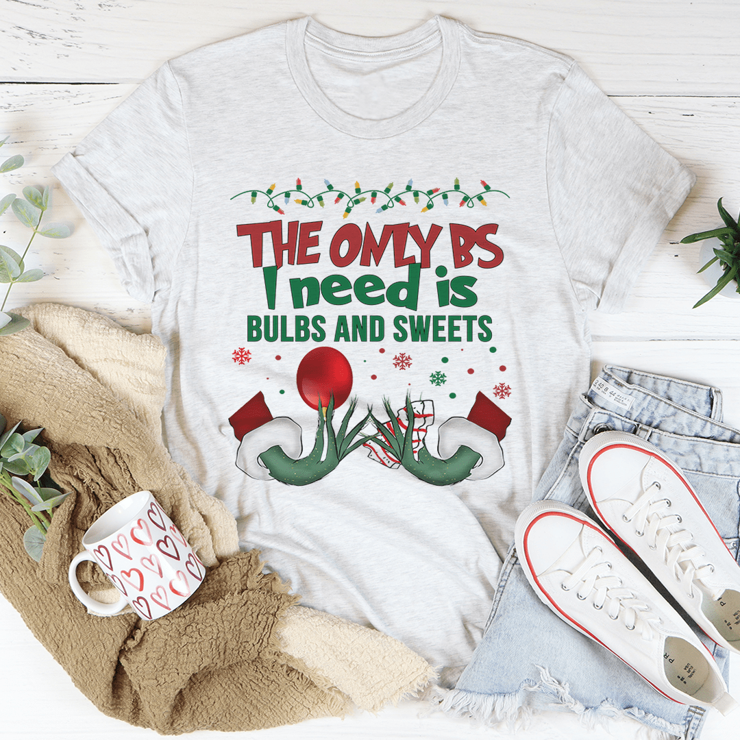 A festive Bulbs And Sweets Tee featuring a colorful holiday design, made from 100% soft cotton, perfect for Christmas celebrations.