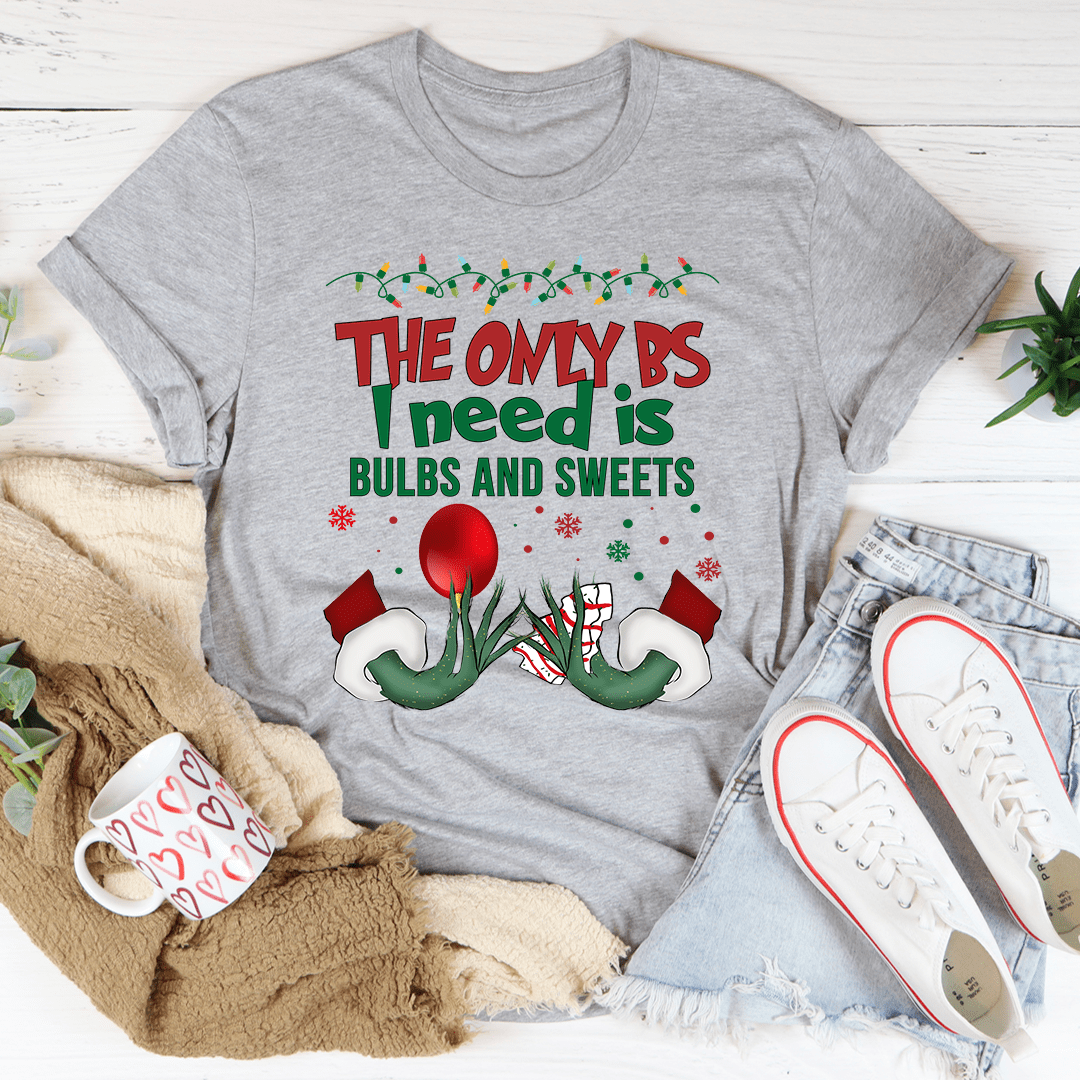A festive Bulbs And Sweets Tee featuring a colorful holiday design, made from 100% soft cotton, perfect for Christmas celebrations.