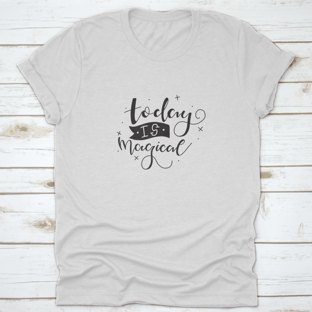A stylish t-shirt featuring a hand-drawn calligraphic motivational quote design, made from soft cotton fabric.