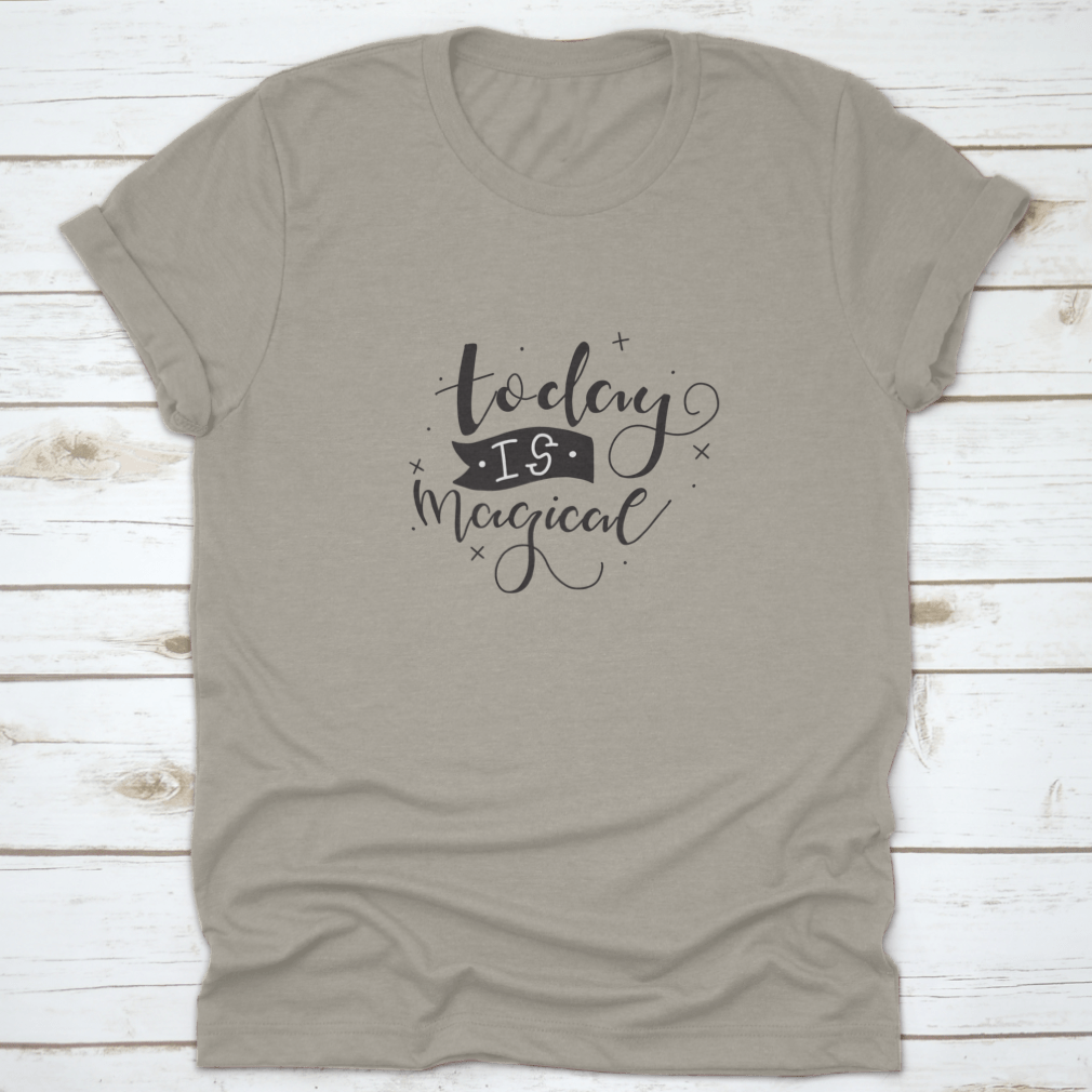 A stylish t-shirt featuring a hand-drawn calligraphic motivational quote design, made from soft cotton fabric.