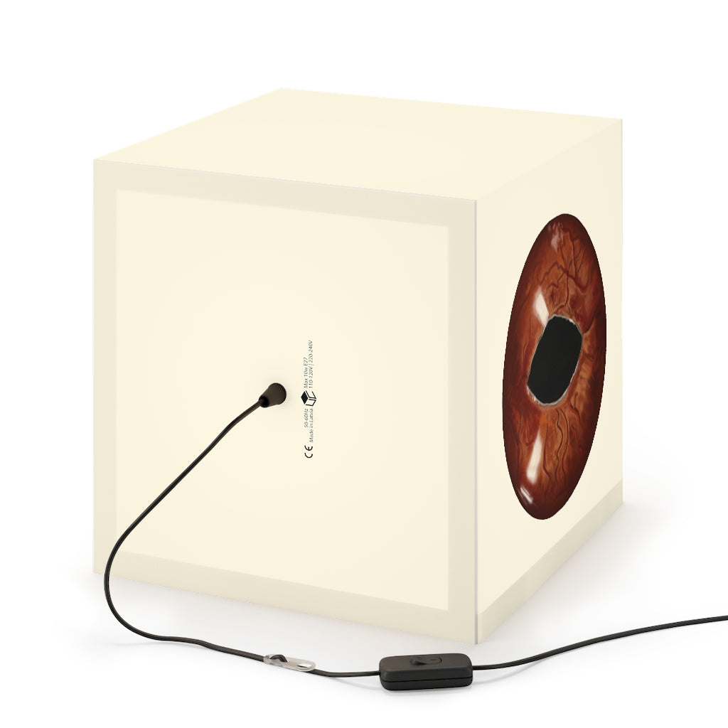 A stylish Cat Eyes Personalized Lamp in a cube shape, showcasing unique designs and providing relaxing lighting for indoor spaces.