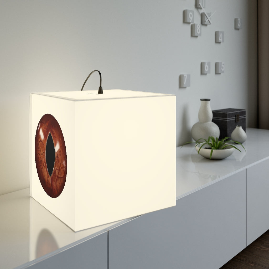 A stylish Cat Eyes Personalized Lamp in a cube shape, showcasing unique designs and providing relaxing lighting for indoor spaces.
