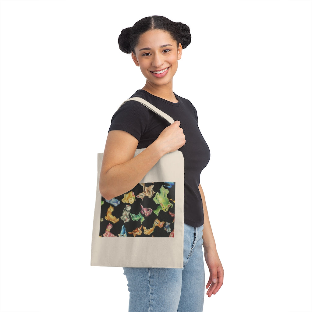 A stylish Cat Pattern Canvas Tote Bag featuring a whimsical cat design, made from durable 100% cotton sheeting with reinforced handles.