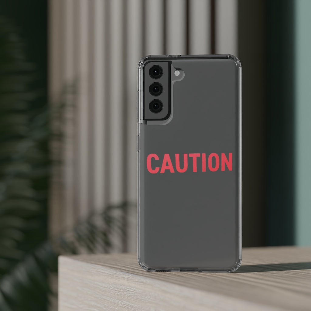 Caution Clear Case showcasing a crystal clear design with cushioned TPU edges, protecting a smartphone.