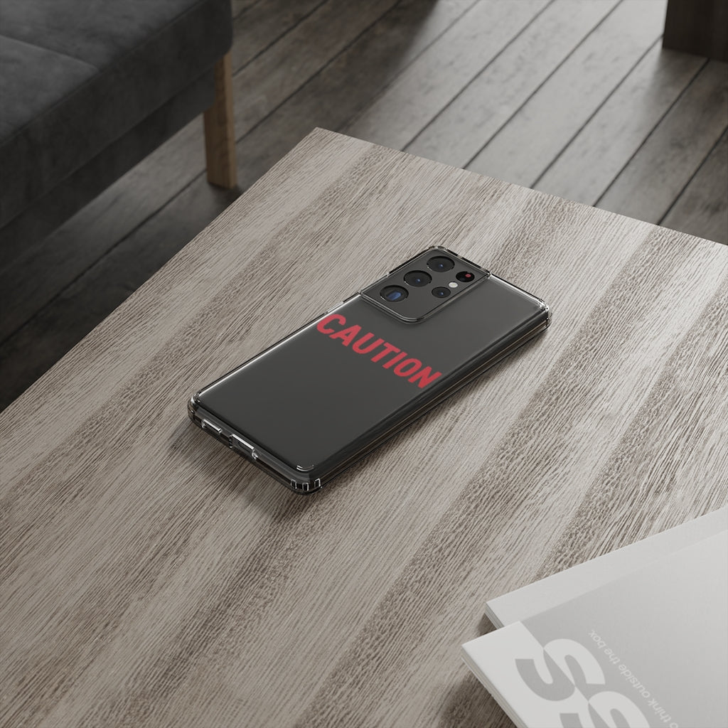 Caution Clear Case showcasing a crystal clear design with cushioned TPU edges, protecting a smartphone.