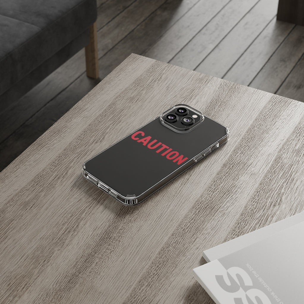 Caution Clear Case showcasing a crystal clear design with cushioned TPU edges, protecting a smartphone.
