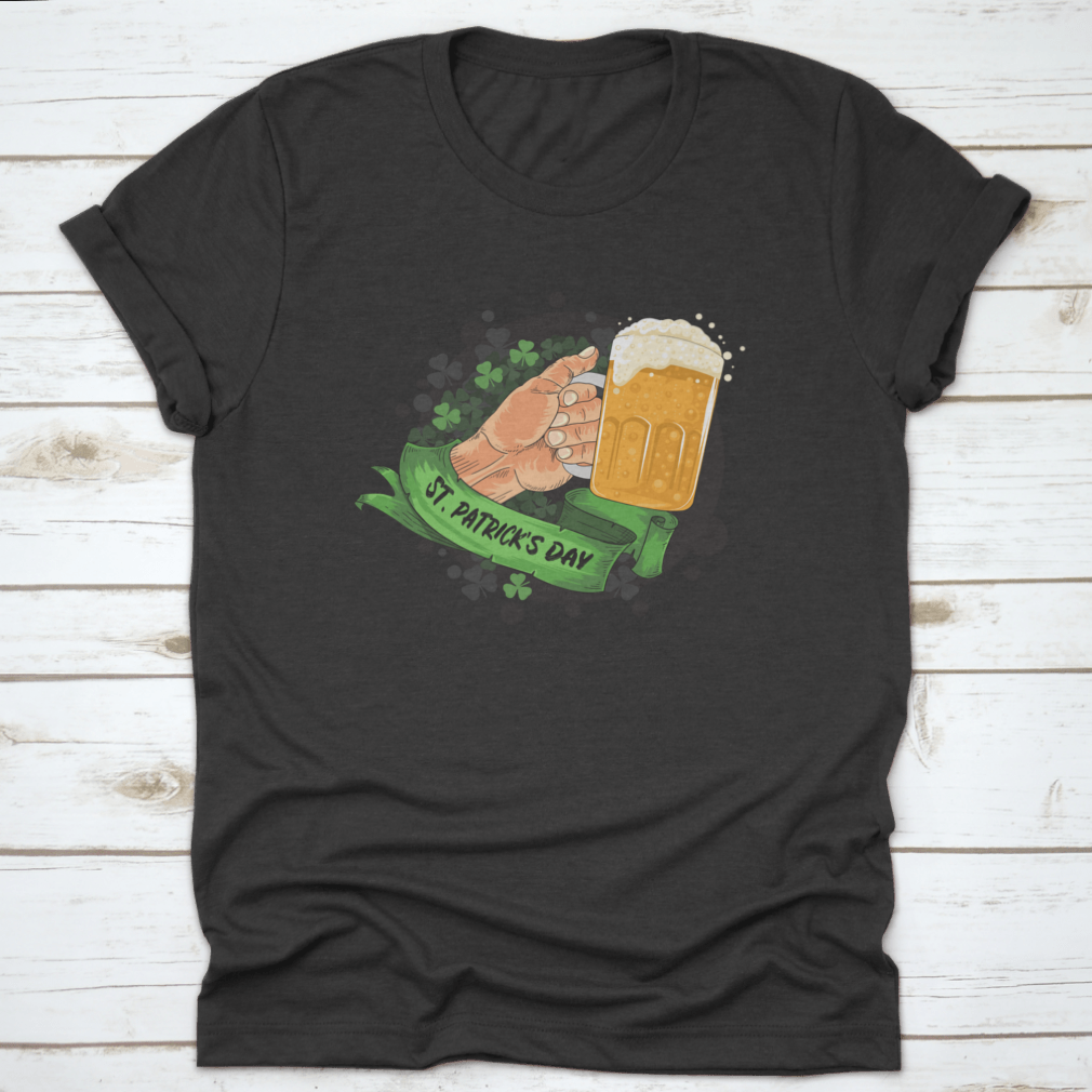 A festive T-shirt featuring a hand holding a beer glass with a clover design, perfect for St. Patrick's Day celebrations.