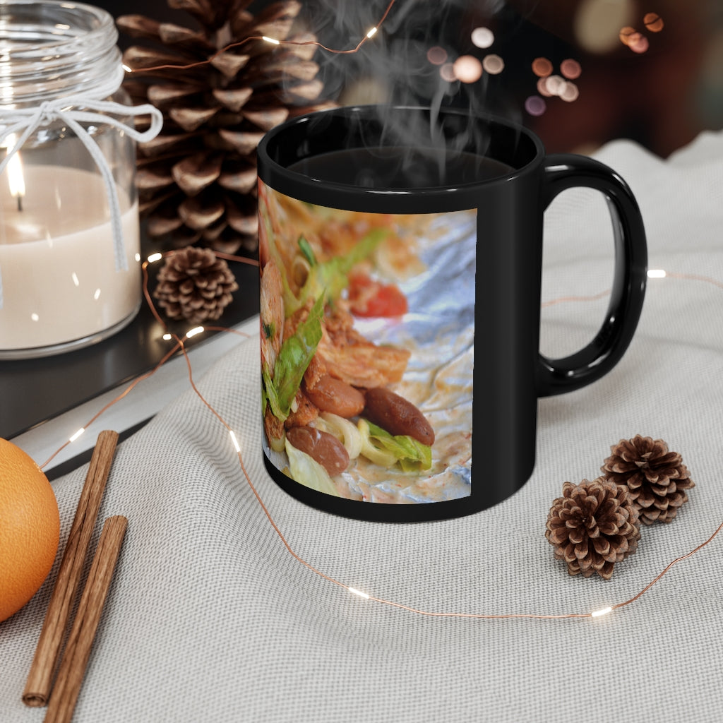 A stylish black ceramic mug with a C-handle, featuring an 11oz capacity, perfect for coffee, tea, or hot chocolate.