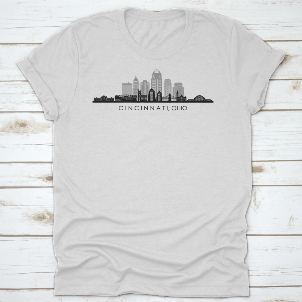 A modern t-shirt featuring the skyline silhouette of Cincinnati, Ohio, showcasing iconic buildings in a stylish design.