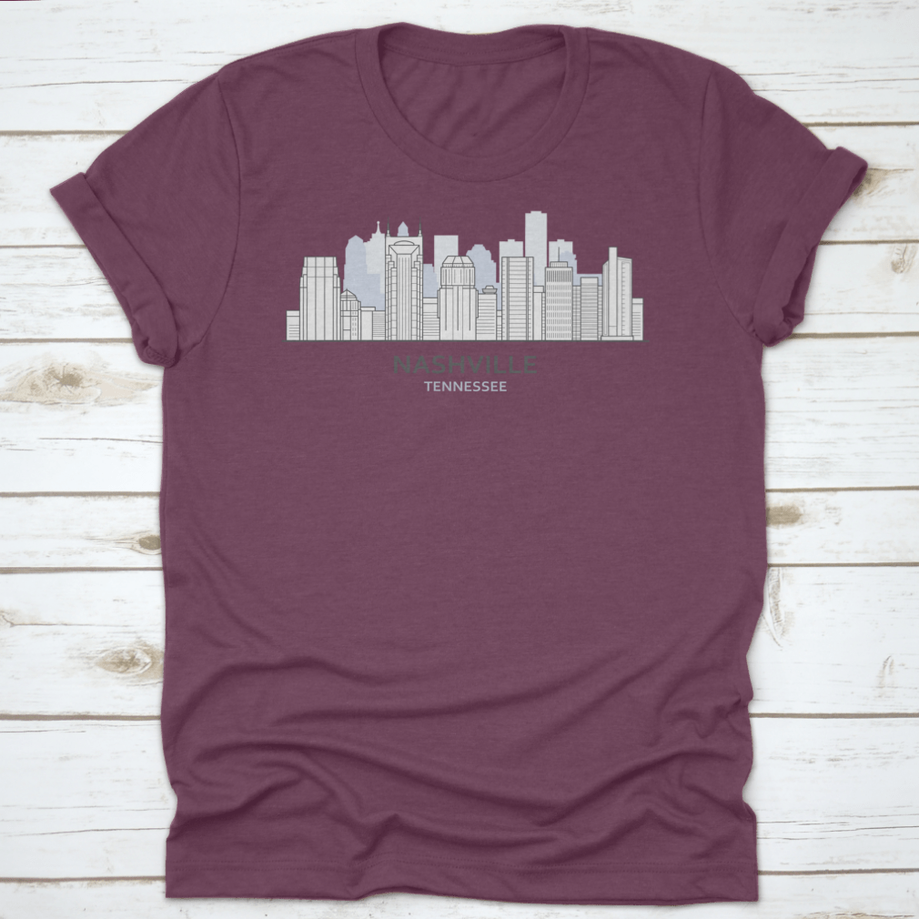A stylish T-shirt featuring a line art design of the Nashville, Tennessee skyline, showcasing iconic buildings and structures.