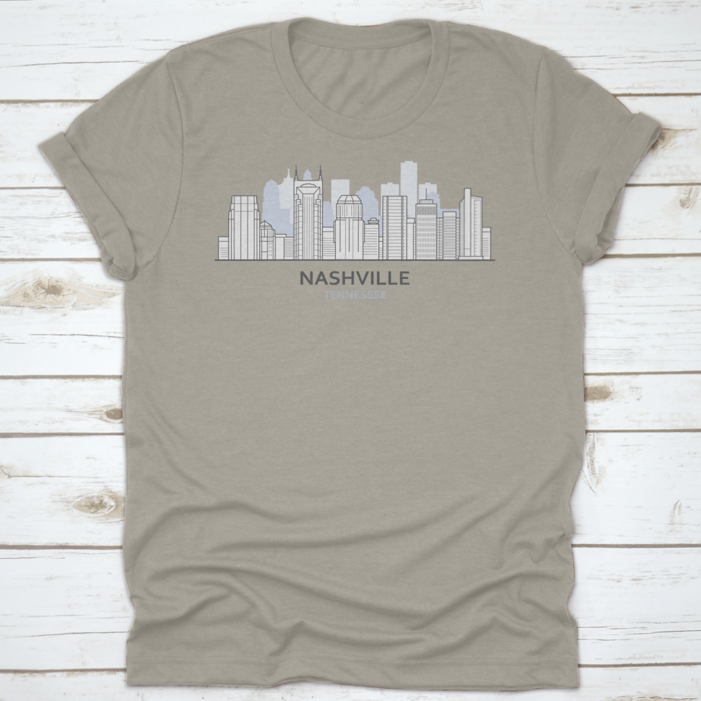 A stylish T-shirt featuring a line art design of the Nashville, Tennessee skyline, showcasing iconic buildings and structures.