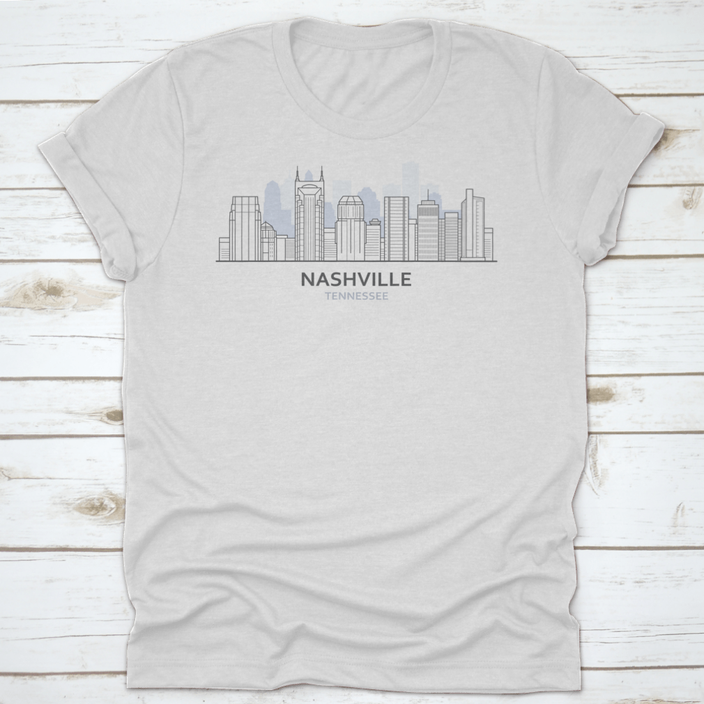 A stylish T-shirt featuring a line art design of the Nashville, Tennessee skyline, showcasing iconic buildings and structures.