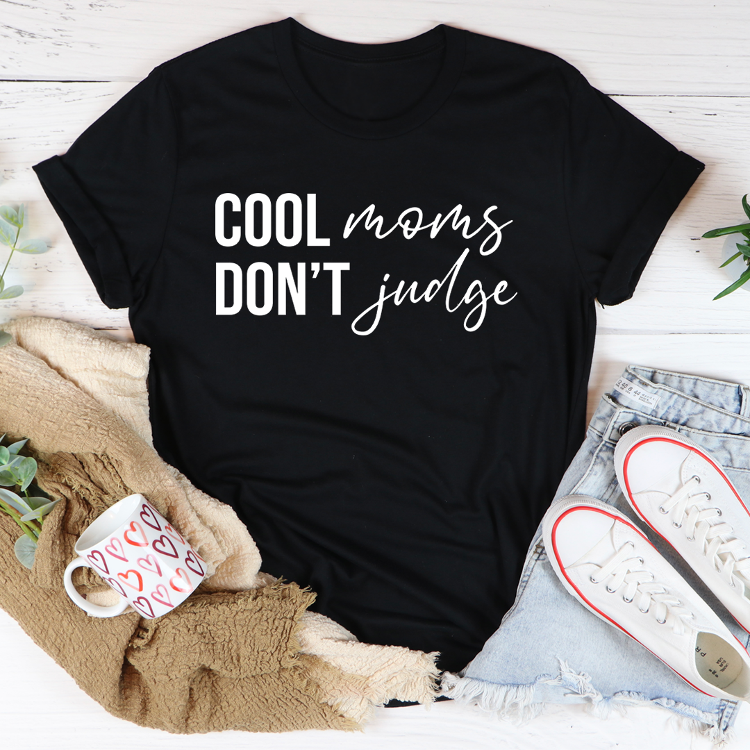 Cool Moms Don't Judge T-Shirt in soft cotton, featuring a humorous print and durable stitching.