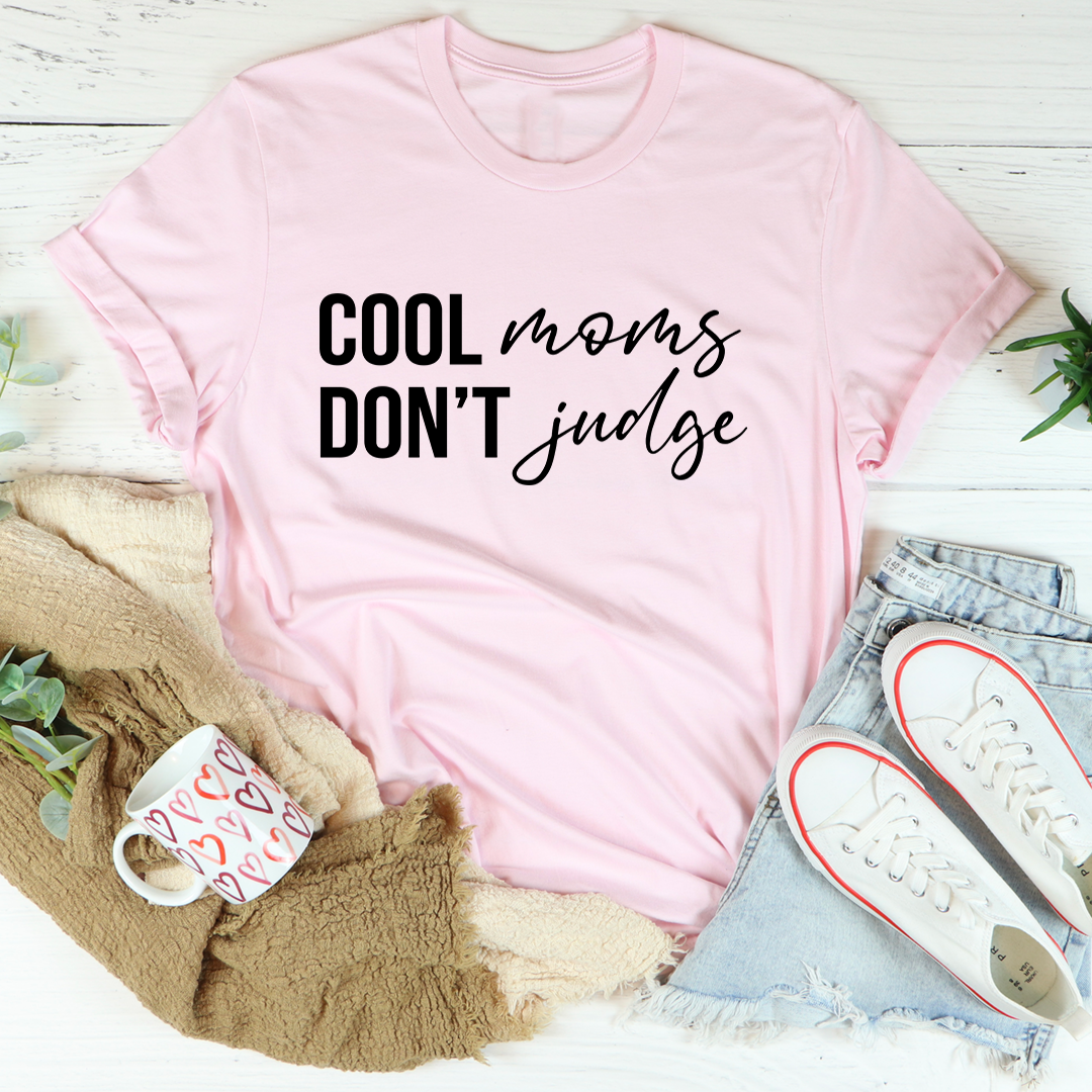 Cool Moms Don't Judge T-Shirt in soft cotton, featuring a humorous print and durable stitching.