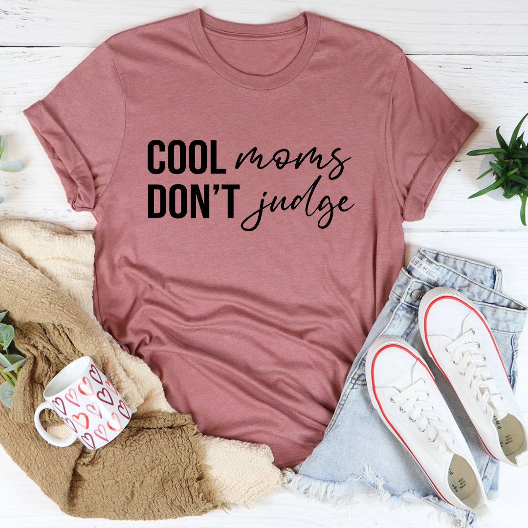 Cool Moms Don't Judge T-Shirt in soft cotton, featuring a humorous print and durable stitching.