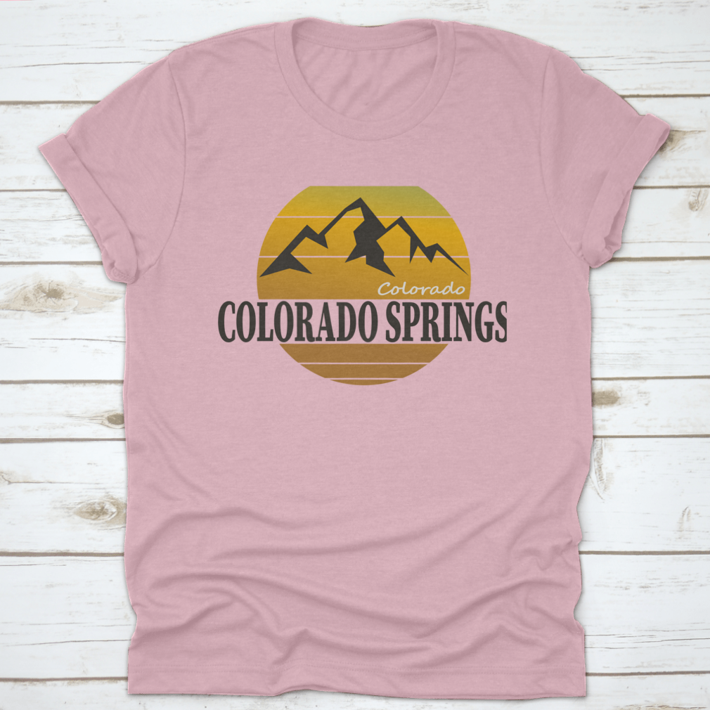 A comfortable Colorado Springs Colorado Tourism T-shirt displayed on a wooden background, showcasing its classic fit and quality fabric.