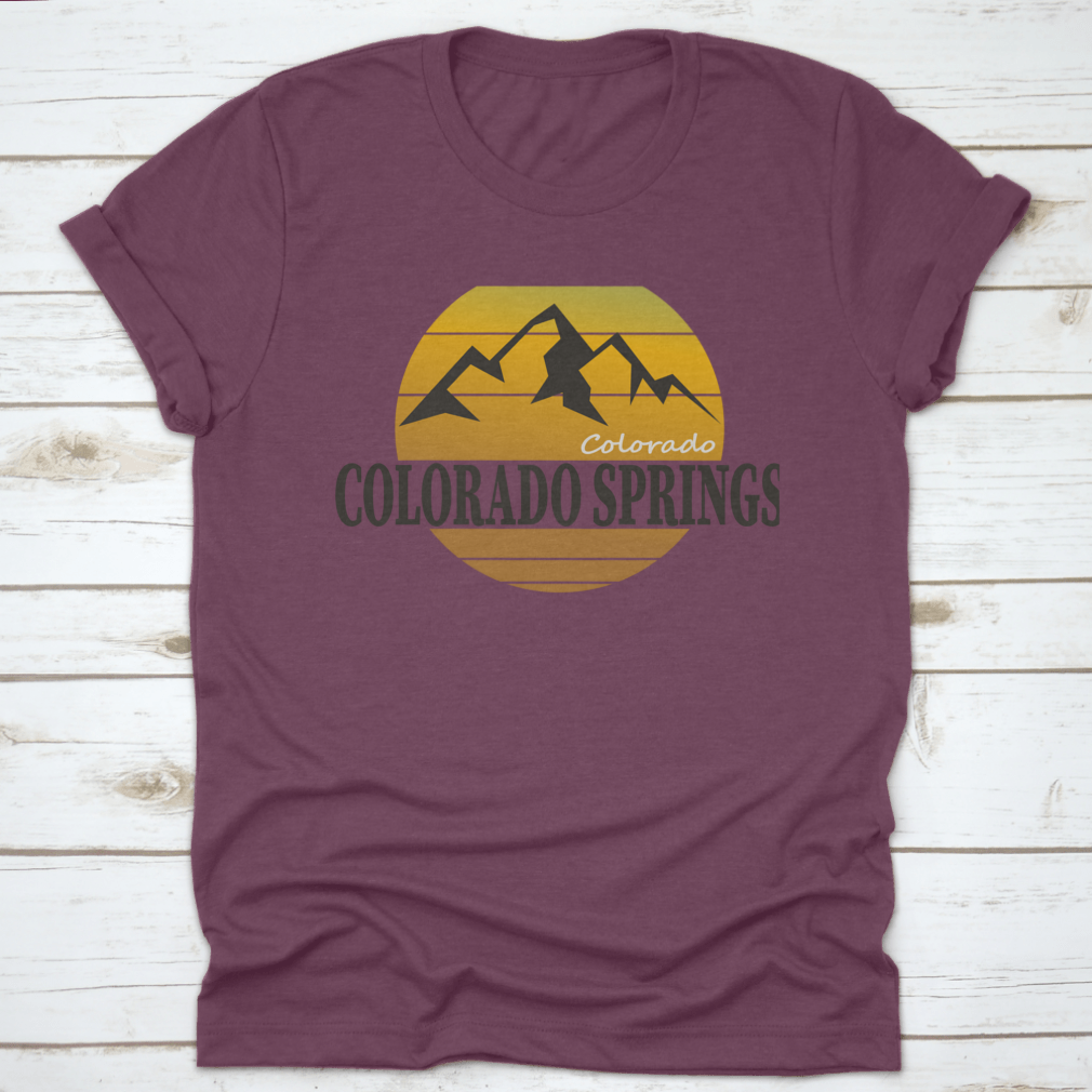 A comfortable Colorado Springs Colorado Tourism T-shirt displayed on a wooden background, showcasing its classic fit and quality fabric.