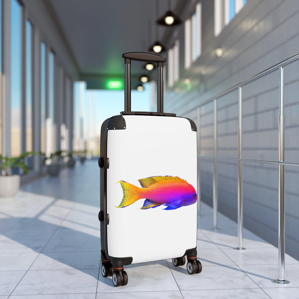 A colorful fish-themed cabin suitcase with a hard-shell design, featuring a telescopic handle and four swivel wheels, perfect for stylish travel.