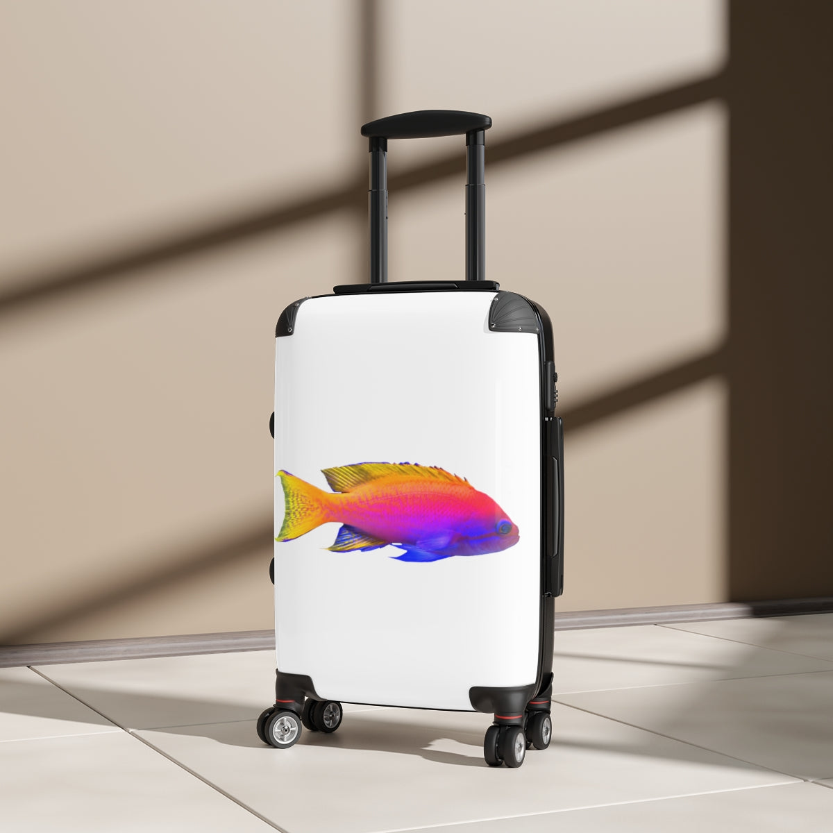 A colorful fish-themed cabin suitcase with a hard-shell design, featuring a telescopic handle and four swivel wheels, perfect for stylish travel.