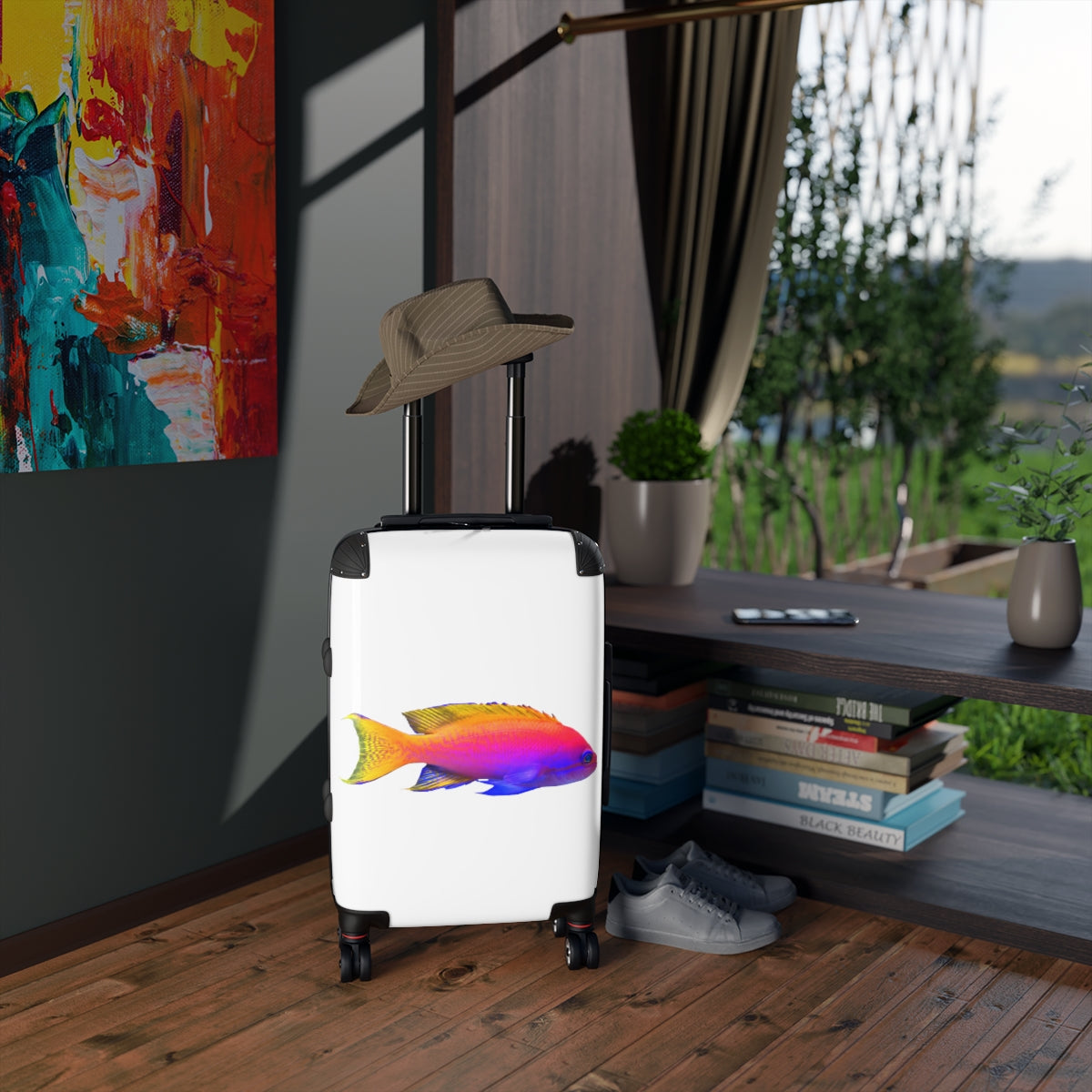 A colorful fish-themed cabin suitcase with a hard-shell design, featuring a telescopic handle and four swivel wheels, perfect for stylish travel.