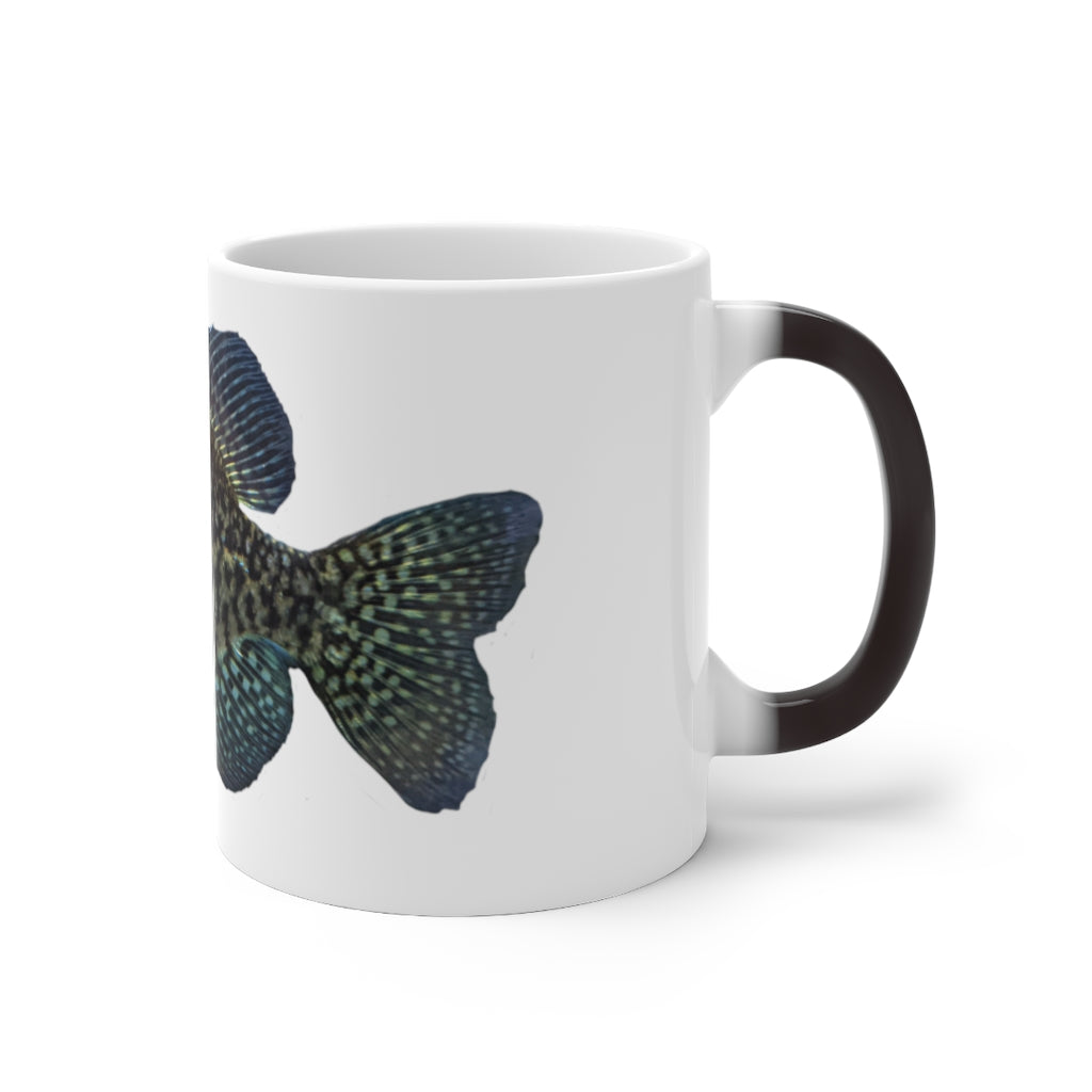 A whimsical colored fish design on a color-changing ceramic mug, showcasing its vibrant transformation when filled with hot liquid.