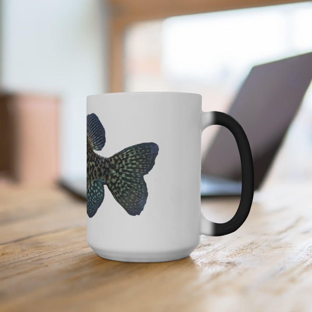 A whimsical colored fish design on a color-changing ceramic mug, showcasing its vibrant transformation when filled with hot liquid.
