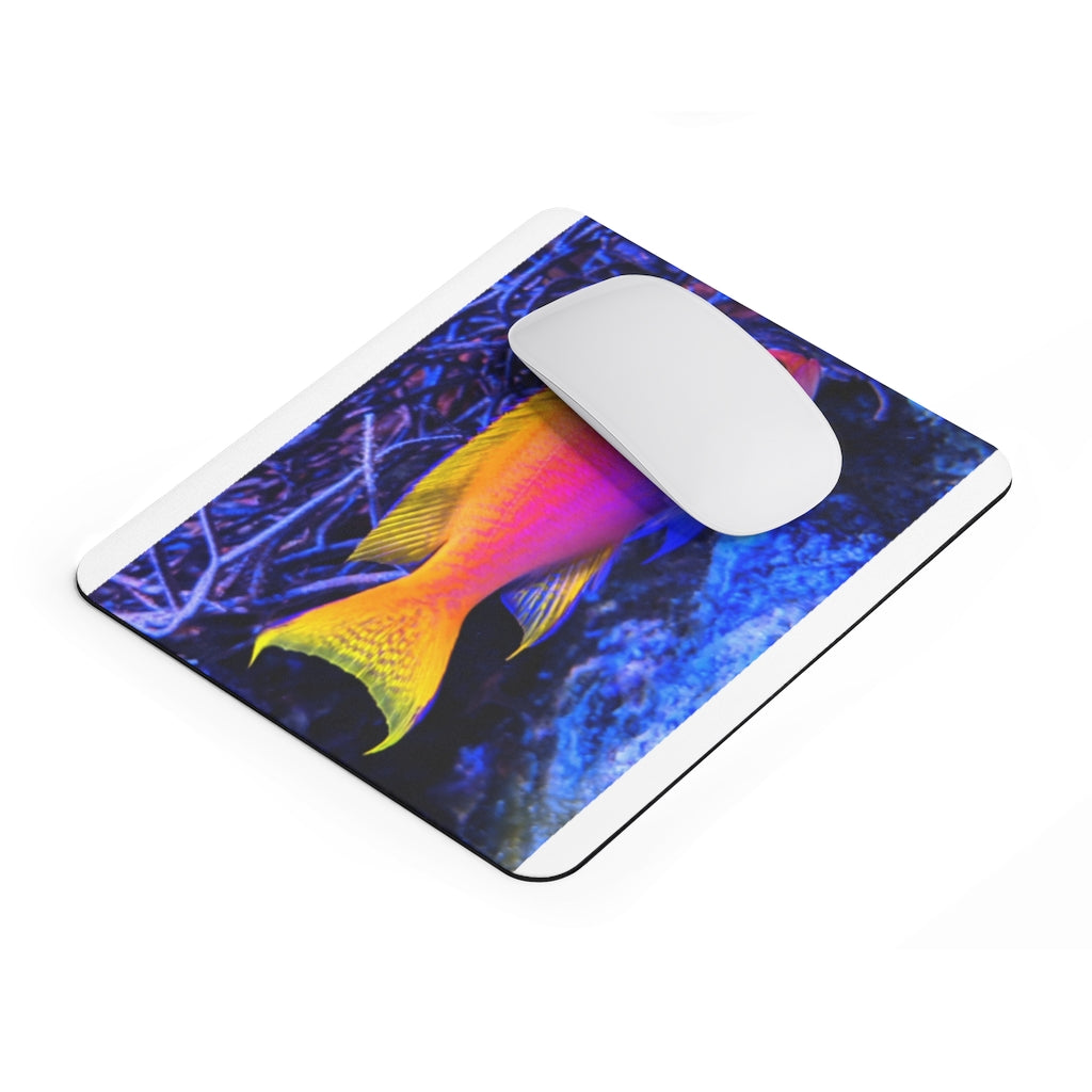 Colored Fish Mouse Pad featuring vibrant fish design on a smooth surface, ideal for enhancing desk decor.