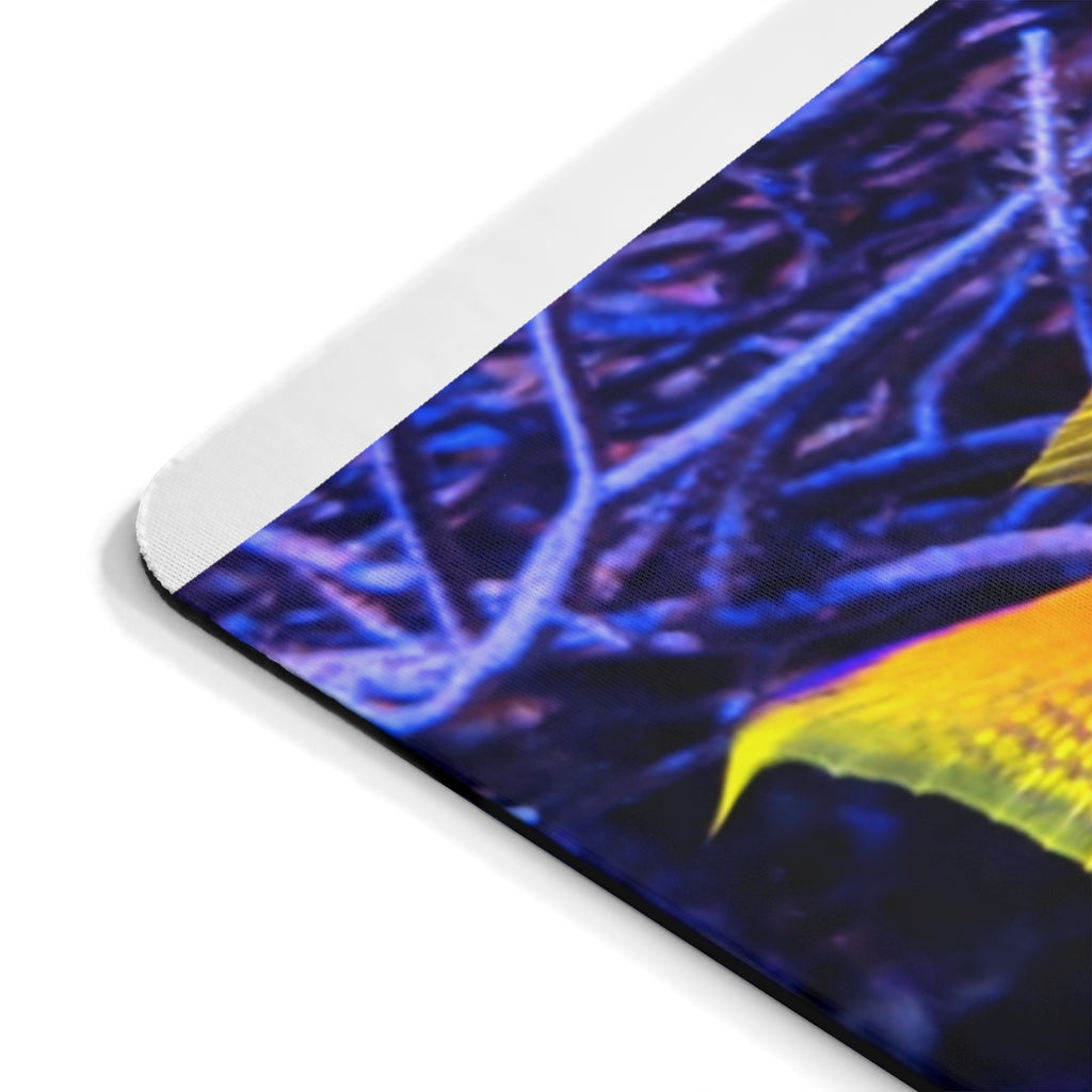 Colored Fish Mouse Pad featuring vibrant fish design on a smooth surface, ideal for enhancing desk decor.