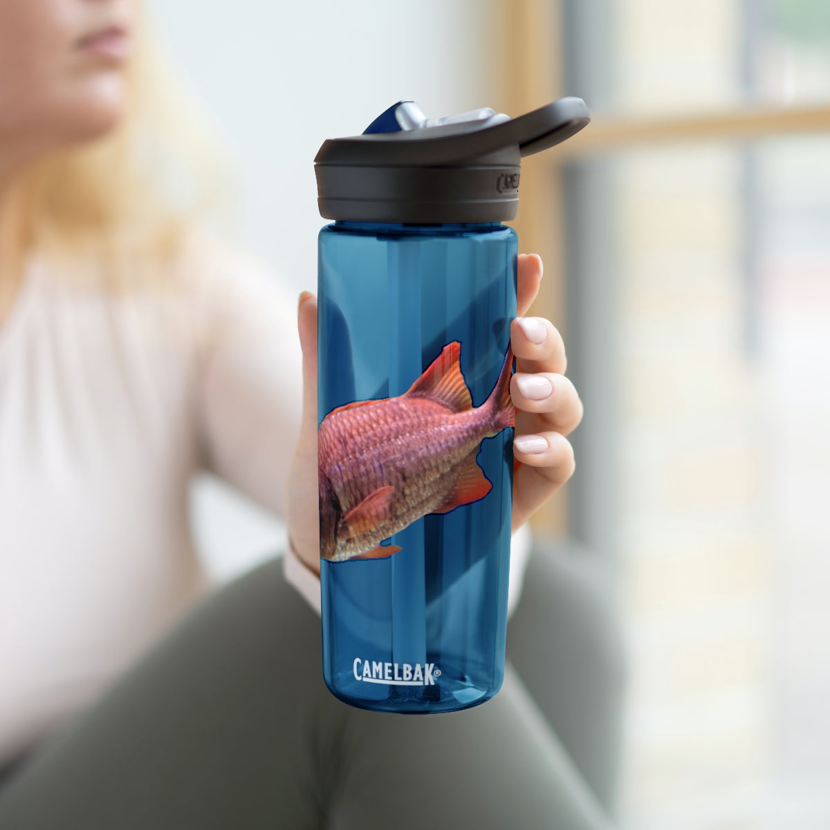 Colorful Fish CamelBak Eddy® Water Bottle in vibrant colors, showcasing its durable design and easy-carry handle.