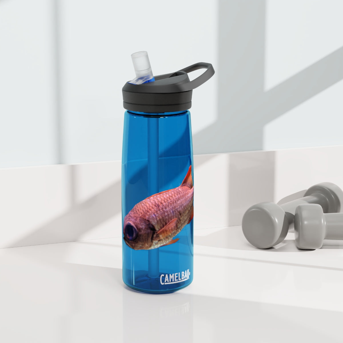 Colorful Fish CamelBak Eddy® Water Bottle in vibrant colors, showcasing its durable design and easy-carry handle.