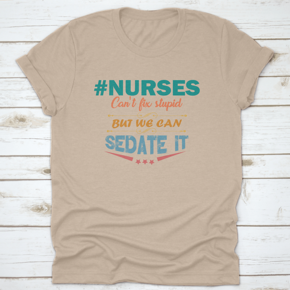 Colorful nurse shirt with the saying 'Nurses Can't Fix Stupid But We Can Sedate It', showcasing a humorous design perfect for healthcare professionals.