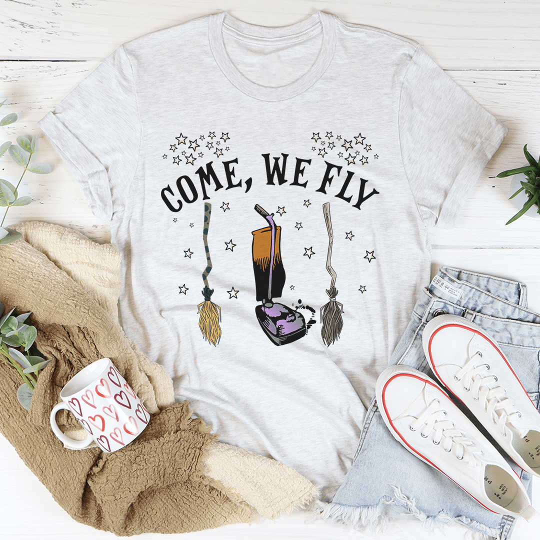 Come We Fly Tee featuring a vibrant Halloween design, made from 100% soft cotton, perfect for festive celebrations.