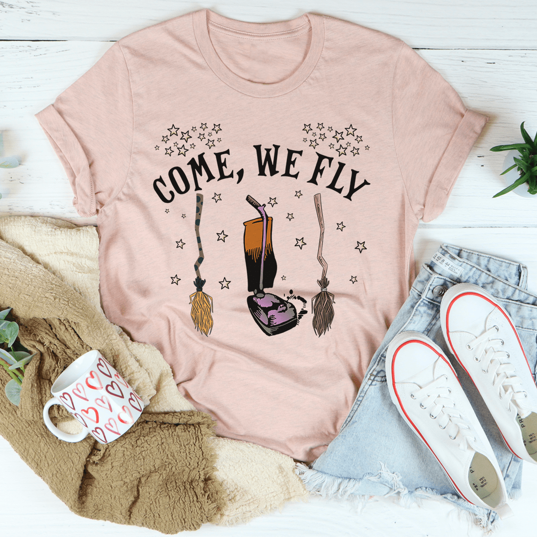 Come We Fly Tee featuring a vibrant Halloween design, made from 100% soft cotton, perfect for festive celebrations.