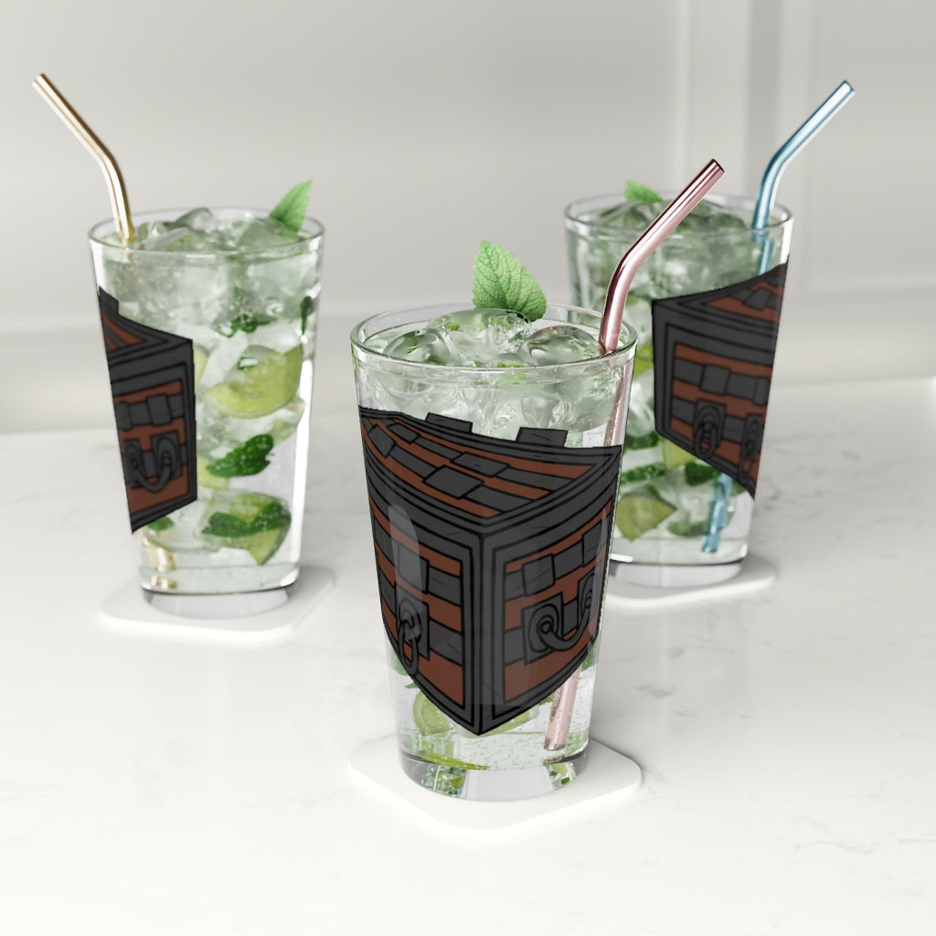 A clear 16oz Crate Pint Glass showcasing its elegant design, perfect for personalized printing.