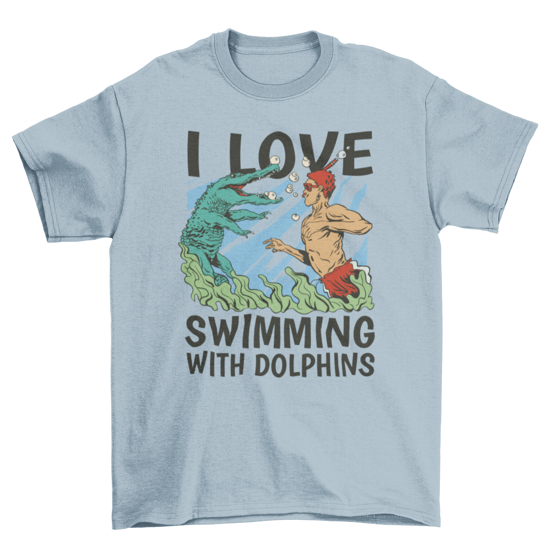 A vibrant t-shirt featuring a man swimming with a crocodile in the sea, with the quote 'I love swimming with dolphins'.