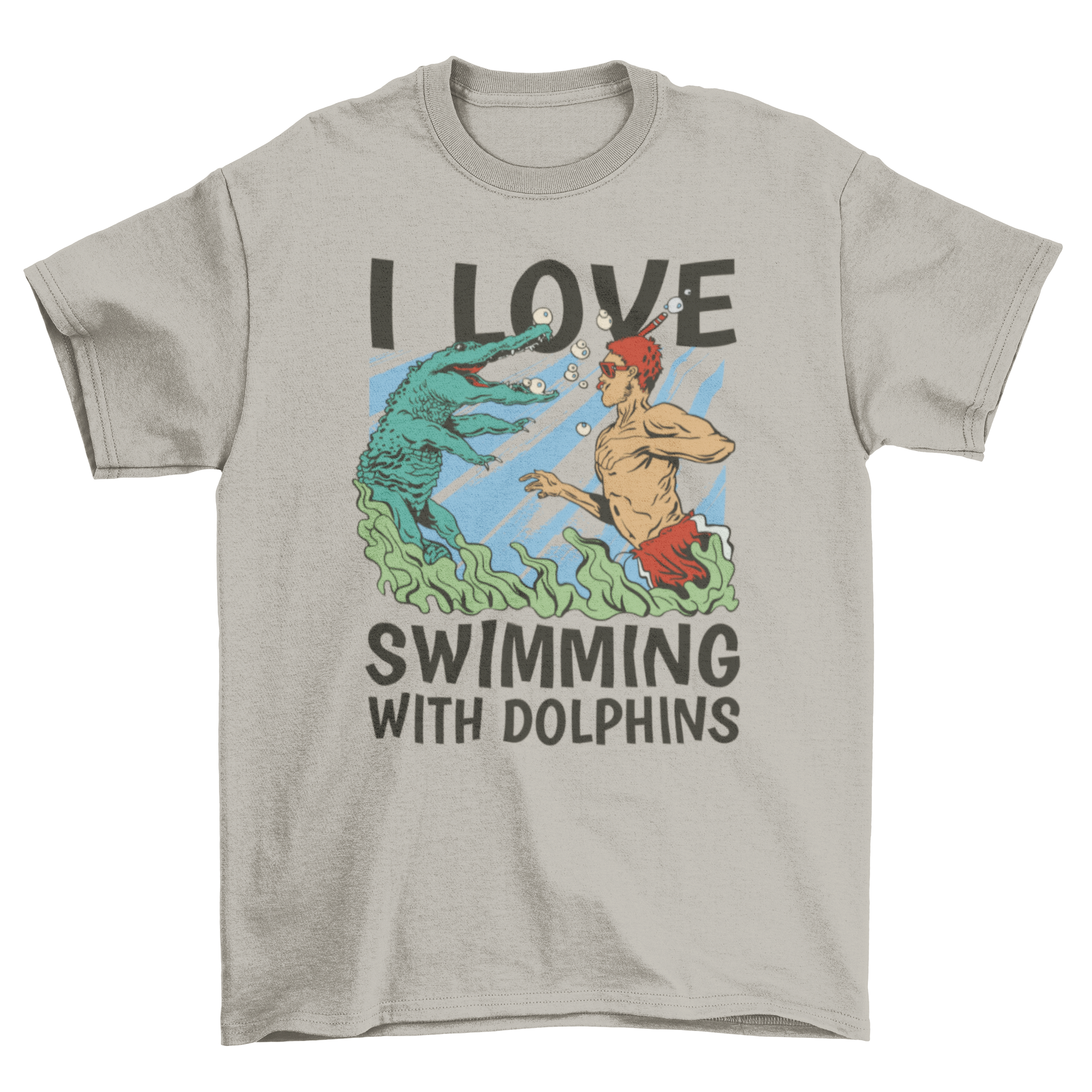 A vibrant t-shirt featuring a man swimming with a crocodile in the sea, with the quote 'I love swimming with dolphins'.