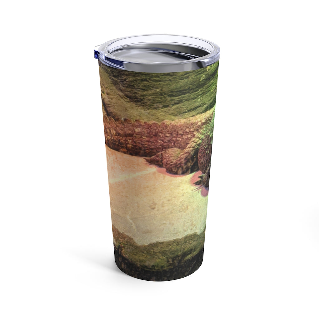 Crocodile Tumbler 20oz in stainless steel with a see-thru plastic lid, showcasing its sleek design and rounded corners.