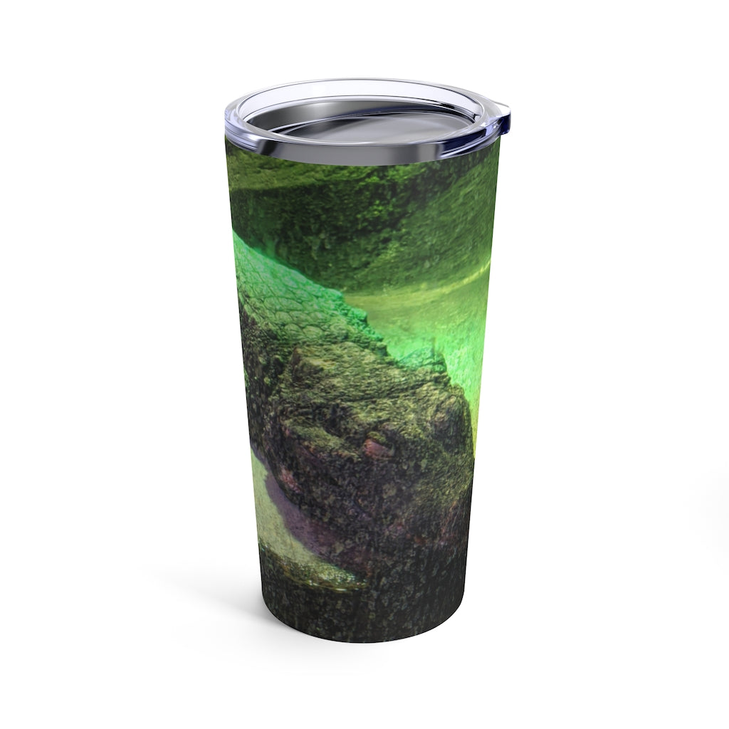 Crocodile Tumbler 20oz in stainless steel with a see-thru plastic lid, showcasing its sleek design and rounded corners.