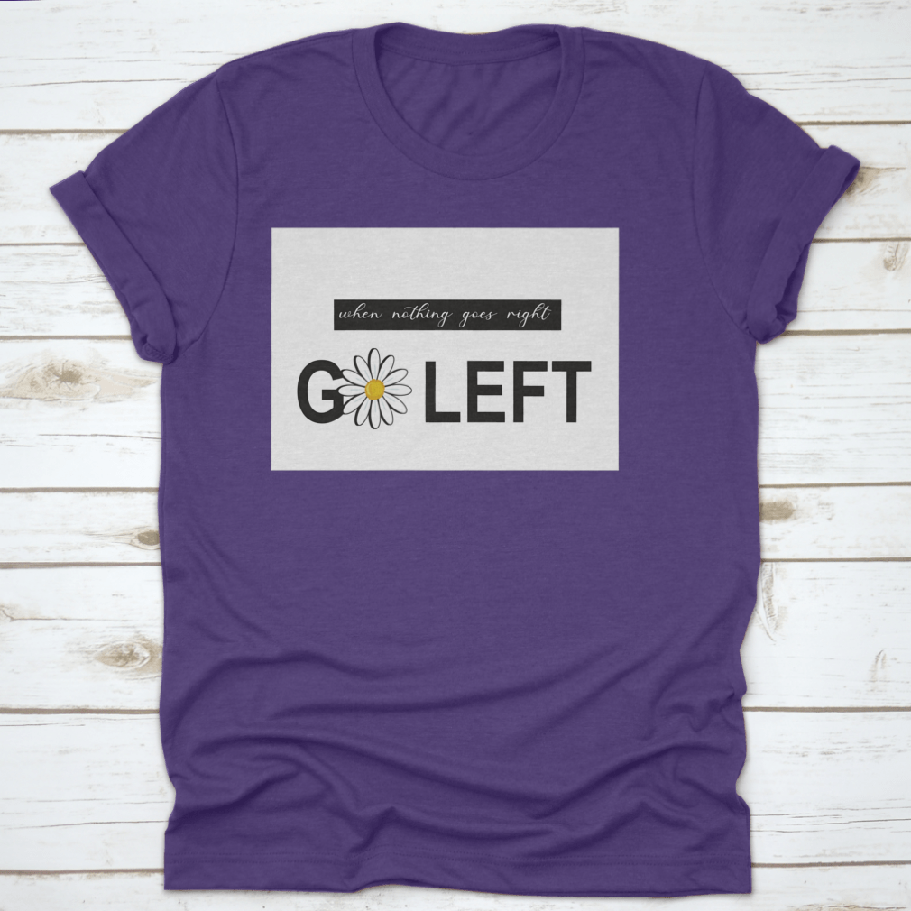 A vibrant t-shirt featuring a positive quote design with daisies and butterflies, showcasing a colorful floral pattern on a soft fabric.