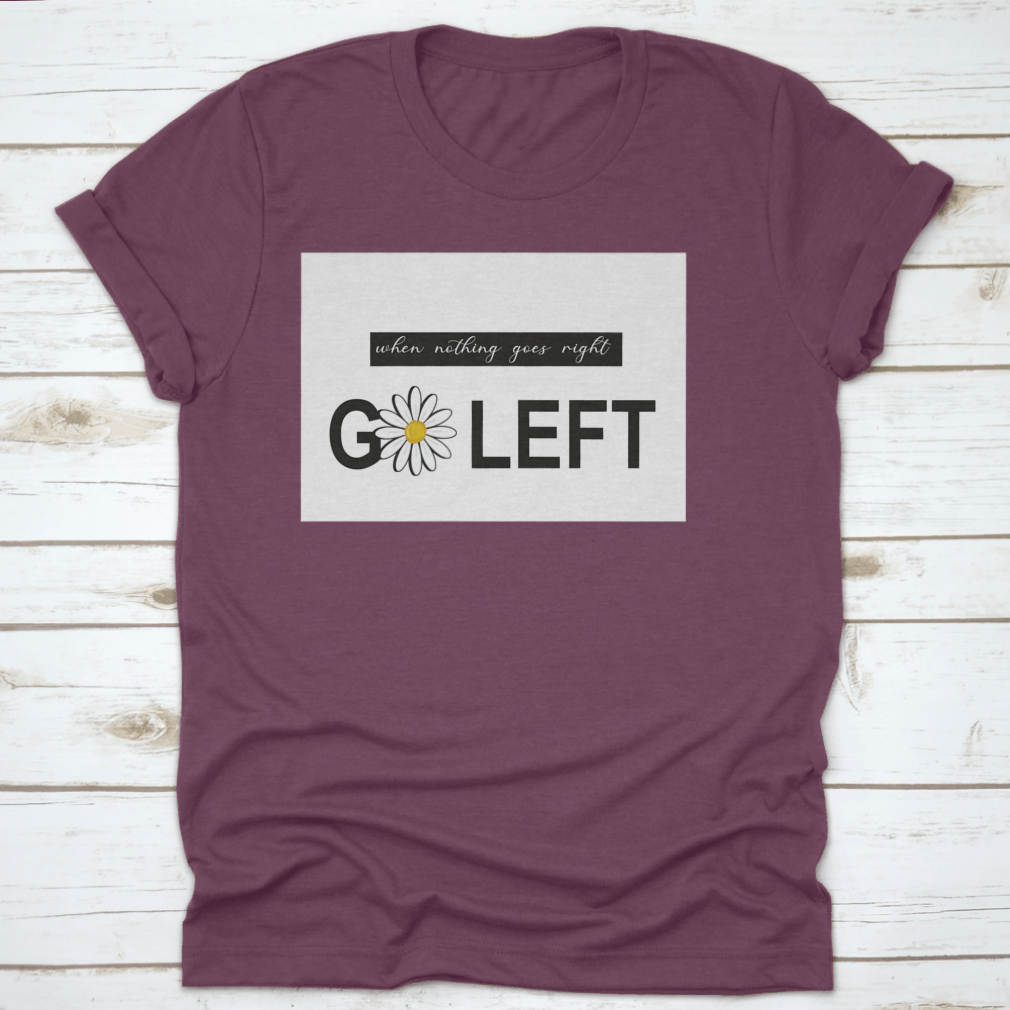 A vibrant t-shirt featuring a positive quote design with daisies and butterflies, showcasing a colorful floral pattern on a soft fabric.