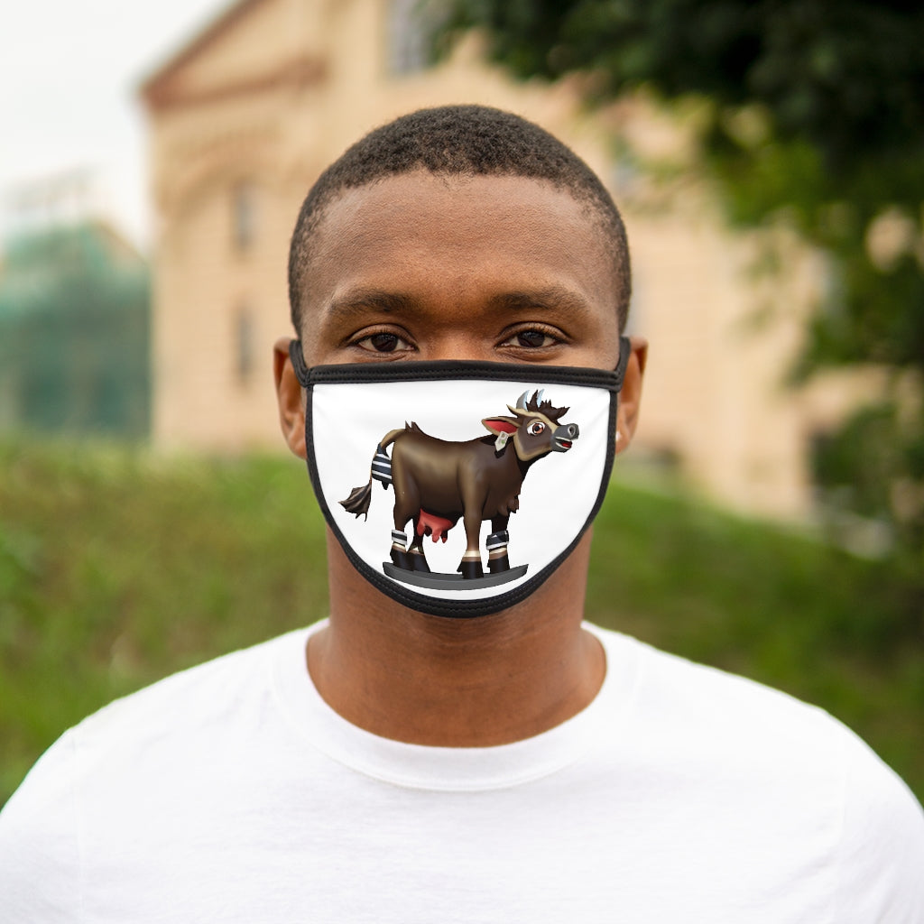 Dark brown cow print face mask with black edges and earloops, made from mixed fabrics for comfort and style.