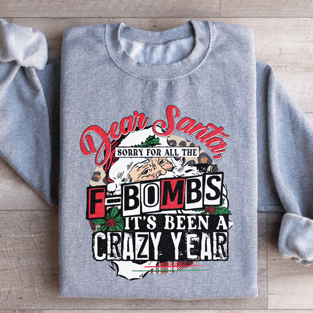A cozy hoodie featuring the phrase 'Dear Santa Sorry For All The F Bombs', designed by top artists, made from a warm cotton/poly fleece blend.