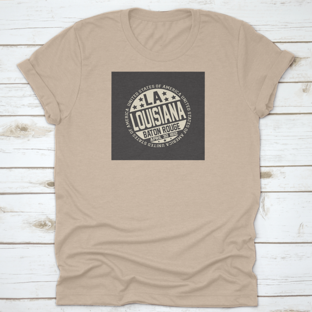 Decorative stamp t-shirt featuring LA postal abbreviation on a black background, showcasing a stylish design.