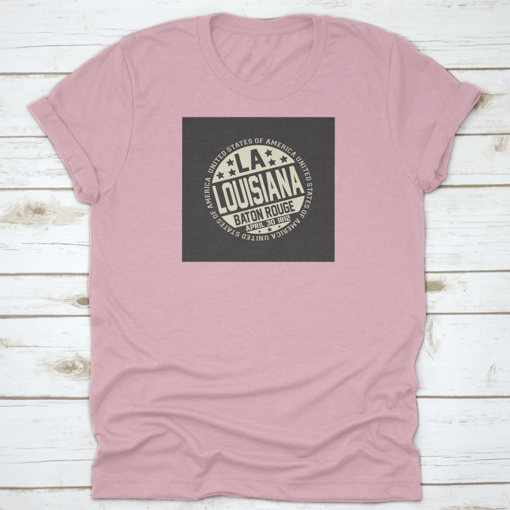 Decorative stamp t-shirt featuring LA postal abbreviation on a black background, showcasing a stylish design.